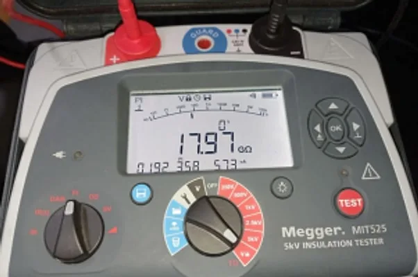 Megger insulation resistance tester showing a measurement reading